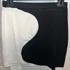 Brand new stretchy black mini skirt with white wave pattern